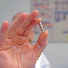 hand holding cobalt-60